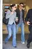th_44168_Preppie_-_Julianna_Margulies_arrives_into_LAX_Airport_-_Jan._16_2010_722_122_498lo.jpg