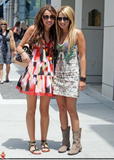 Ashley Tisdale and Miley Cyrus leggy in short dresses in Beverly Hills